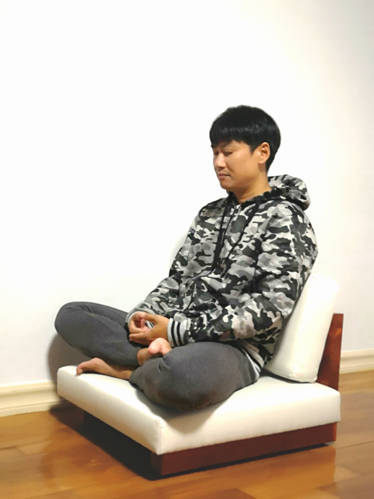Sitting on a meditation chair