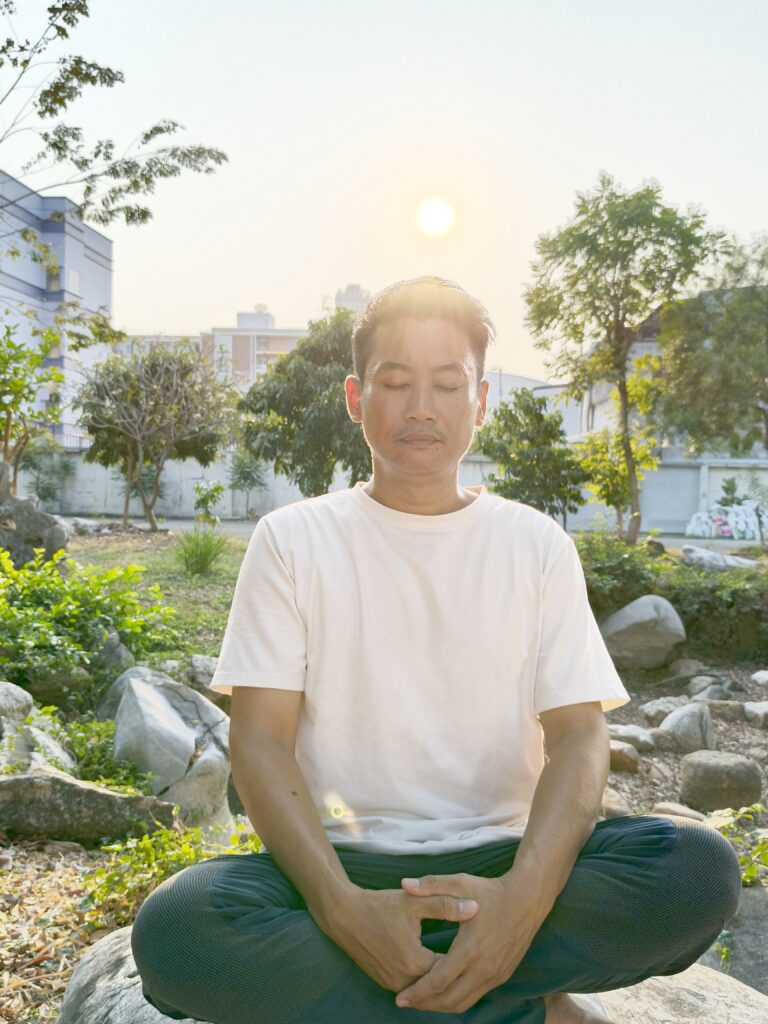 A person meditating in nature 